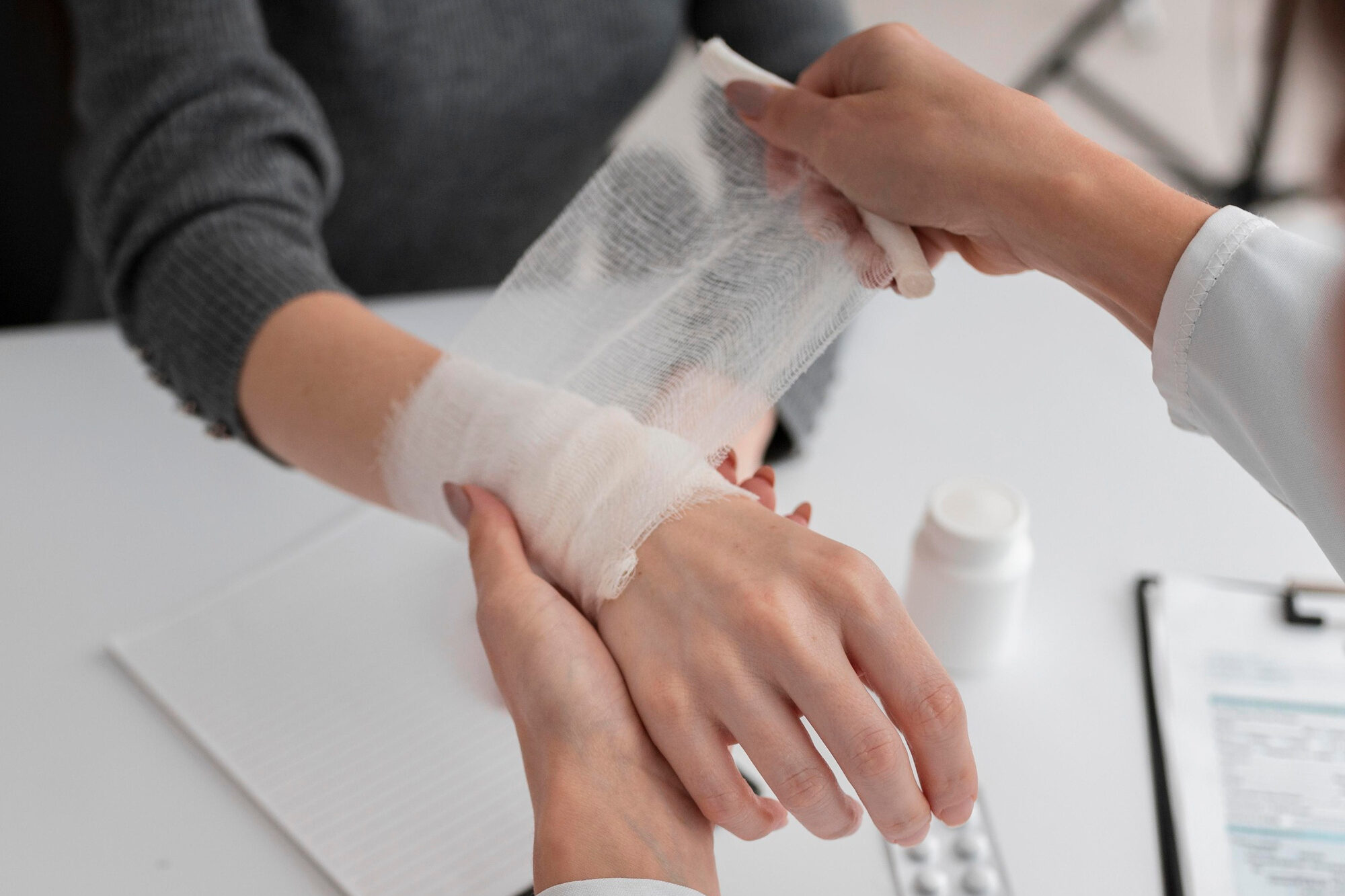 Doctor handling patient's hand with carpal tunnel injuries