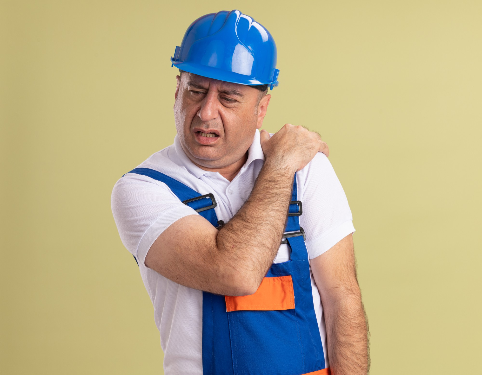 worker suffering from shoulder injuries